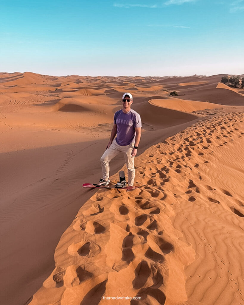 sandboarding in merzouga desert luxury camp